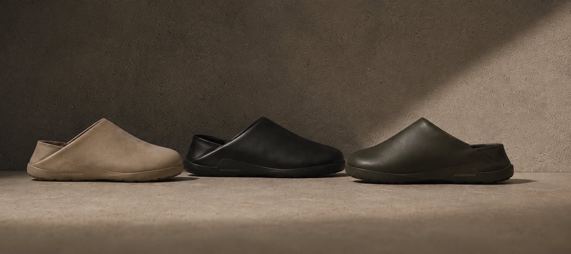 Three Inyo mules in a row — tan suede, black leather, and olive leather.